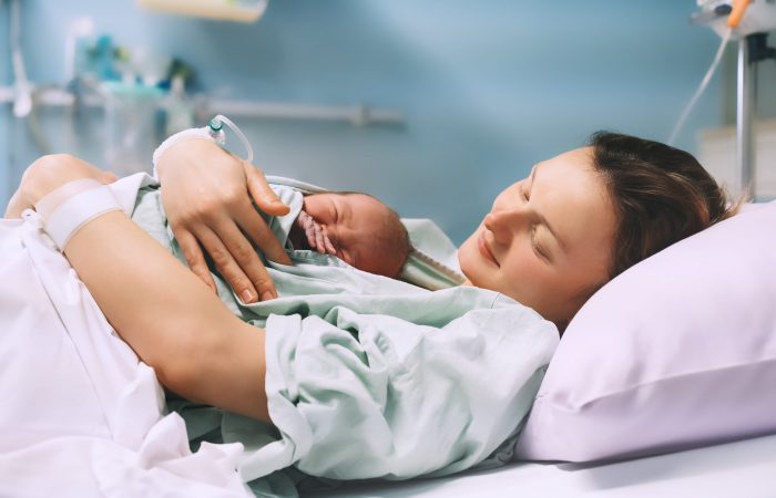 Mother,And,Newborn.,Child,Birth,In,Maternity,Hospital.,Young,Mom